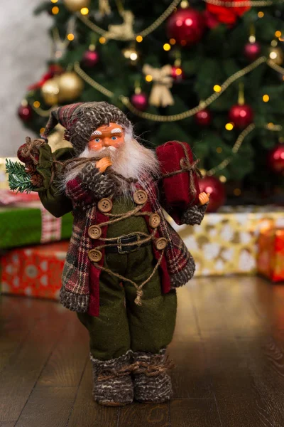 Santa Claus doll with a blush on the cheeks wearing traditional — Stock Photo, Image