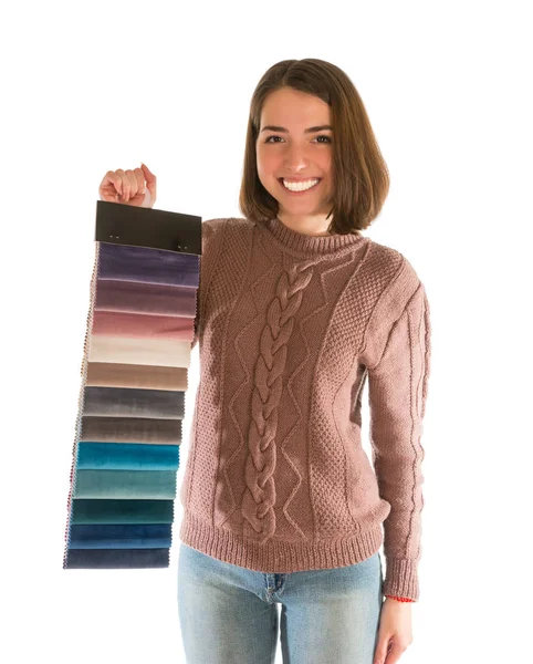 Cute woman in sweater holding fabric swatches — Stock Photo, Image