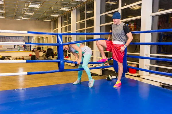 Sporty woman coming in regular boxing ring — Stock Photo, Image