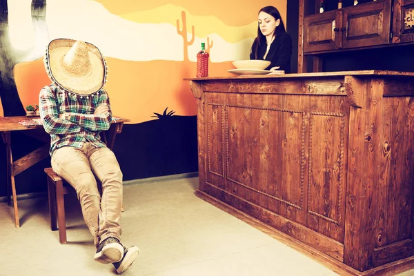 A man in a Mexican bar got drunk and fell asleep sitting on a ch — Stock Photo, Image