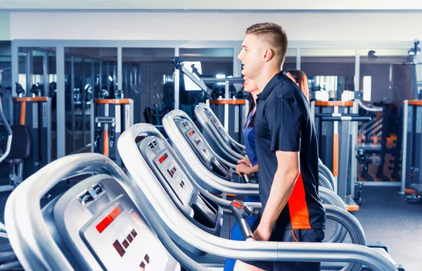 Handsome fit man exercising on a treadmill — Stock Photo, Image