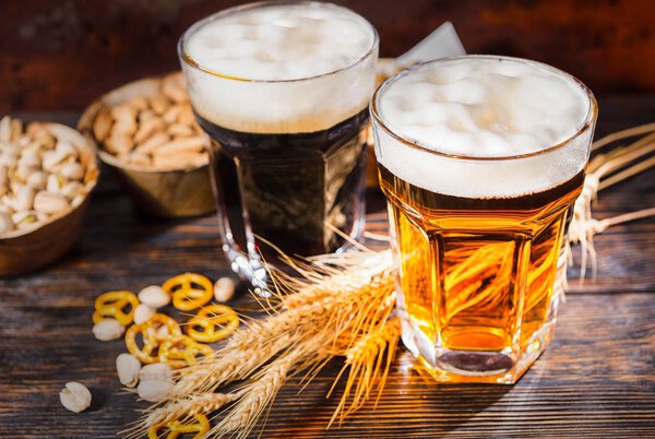 Top view of two big glasses with freshly loured dark and light b
