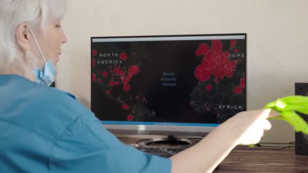 Woman setting aside gloves and mask as she works — Stock Video