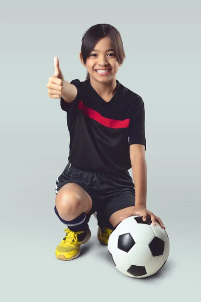 Young asian girl holding soccer ball — Stock Photo, Image