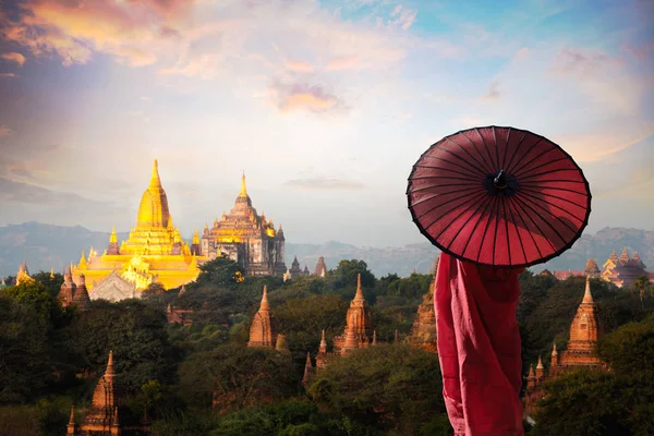 Monk standing with holding umbrella — Stock Photo, Image