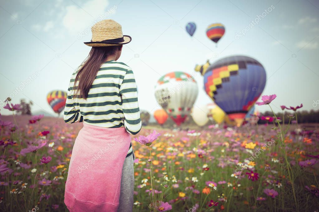 Young girl looking ballooning