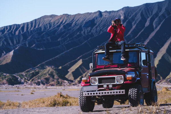 Male tourists stay 4x4 Car service for sight seeing around Bromo