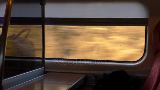 Train window view speed and houses — Stock Video