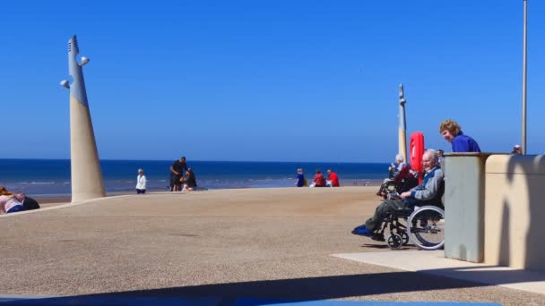 Disabled person on seaside promenade — Stock Video