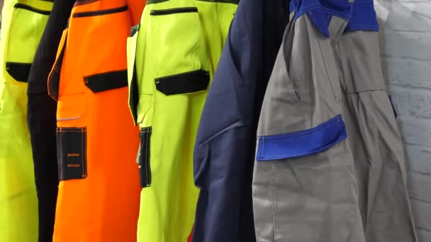 Bright Color High Visibility Work Trousers Hanging Shop Display Rack — Stock Video