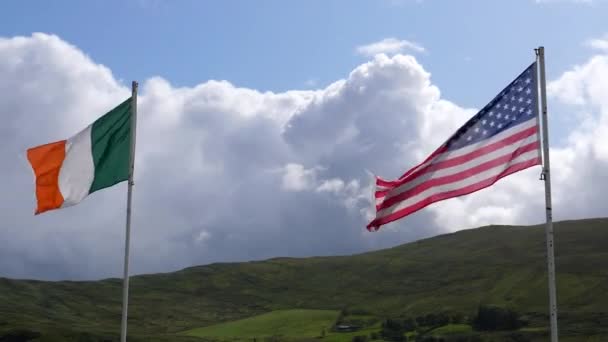 Low Angle View American Irish Flags Waving Hilly Countryside — Stock Video
