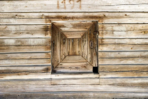 Timber made hatch in a wooden wall — Stock Photo, Image