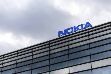 Dark clouds over Nokia logo on top of a building clipart