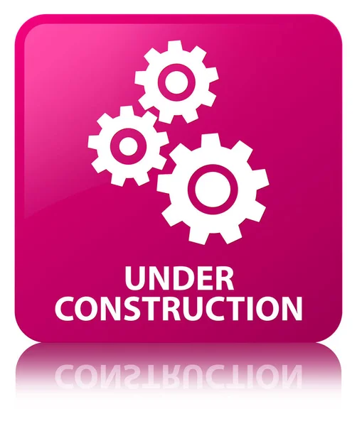 建設 (歯車のアイコン) ピンクの正方形ボタンの下 — ストック写真