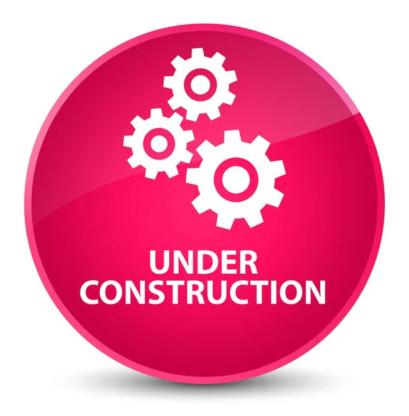 En construcción (icono de engranajes) botón redondo rosa elegante — Foto de Stock