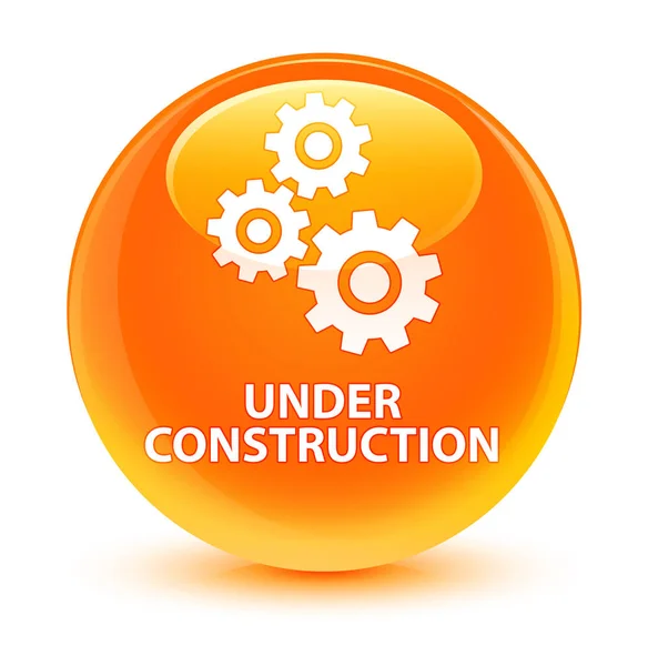 Under construction (gears icon) glassy orange round button — Stock Photo, Image