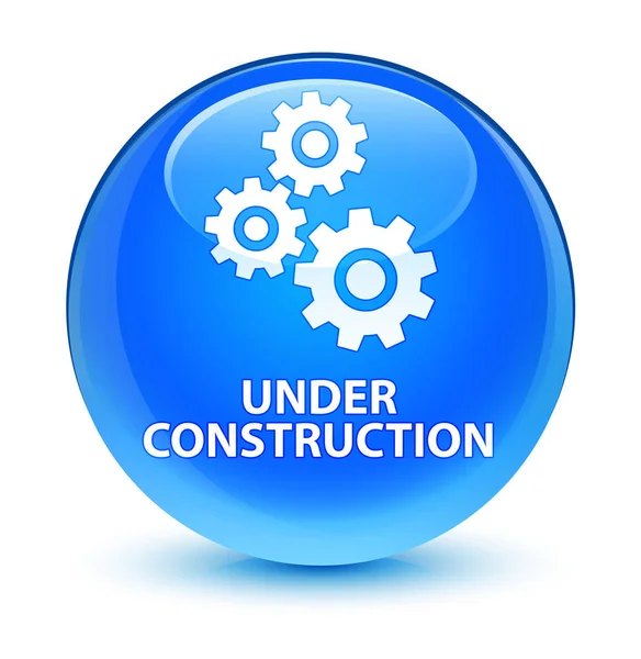 En construcción (icono de engranajes) botón redondo azul cian vidrioso — Foto de Stock