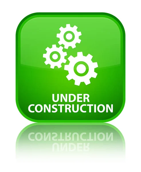 Onder bouw (versnellingen pictogram) speciale groene vierkante knop — Stockfoto