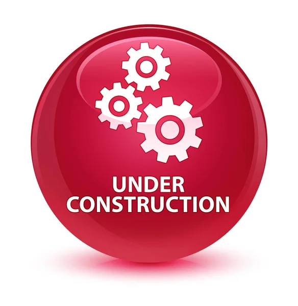 Em construção (ícone de engrenagens) botão redondo rosa vítreo — Fotografia de Stock