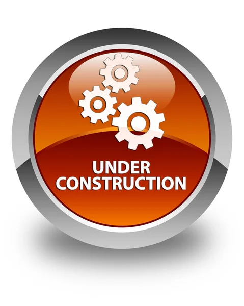 Em construção (ícone de engrenagens) botão redondo marrom brilhante — Fotografia de Stock