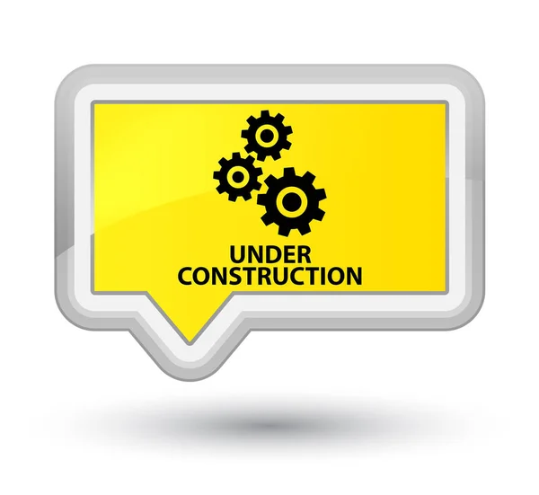 Under construction (gears icon) prime yellow banner button — Stock Photo, Image