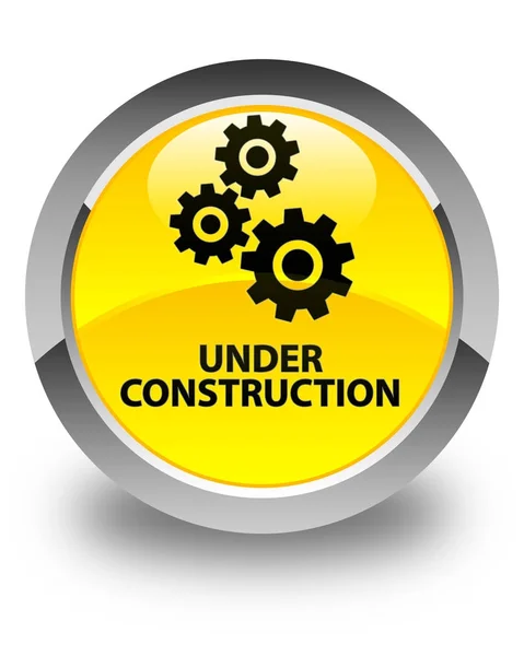 Under construction (gears icon) glossy yellow round button — Stock Photo, Image