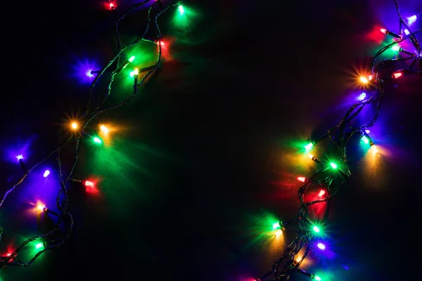 ( 영어 ) Christmas Garland lights on darck background — 스톡 사진