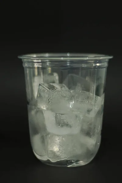 Ice Cubes Plastic Glasses Black Background — Stock Photo, Image