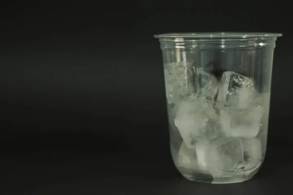 Ice Cubes Plastic Glasses Black Background — Stock Photo, Image
