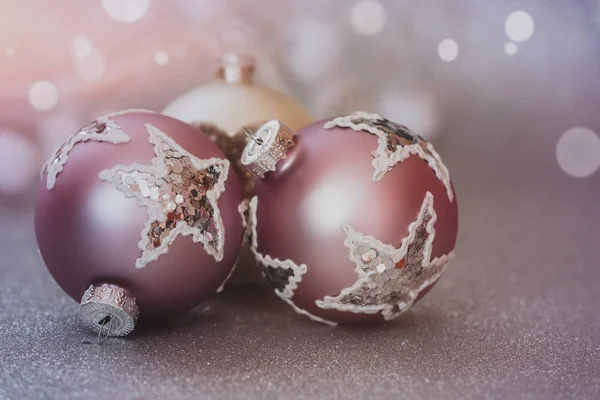 Christmas balls on glitter holiday background