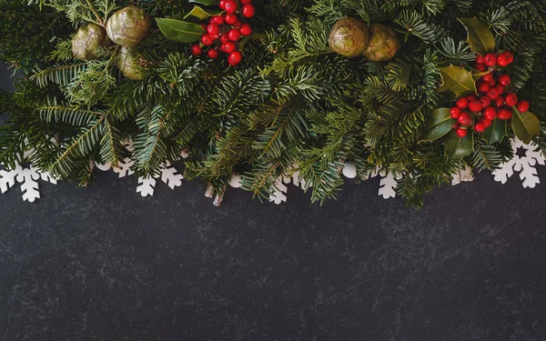 Christmas background with real fir tree and holly berry branches — Stock Photo, Image