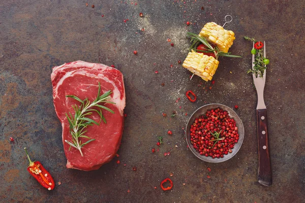 Raw black angus steak with vegetable and seasonings — Stock Photo, Image