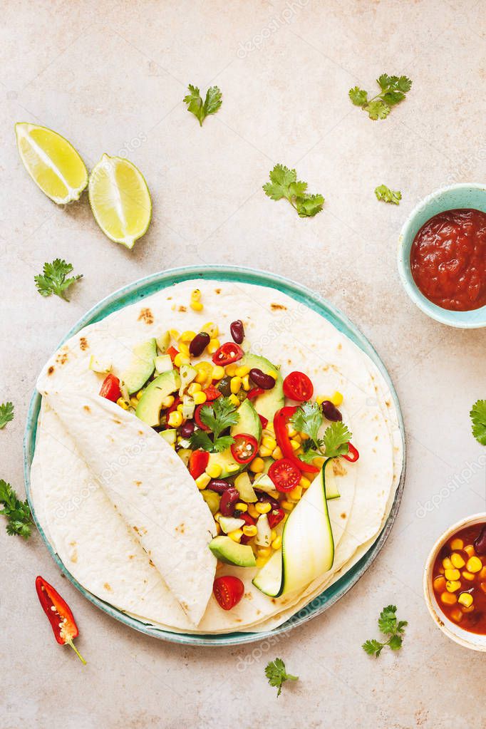 Delicious vegan tacos on rustic background