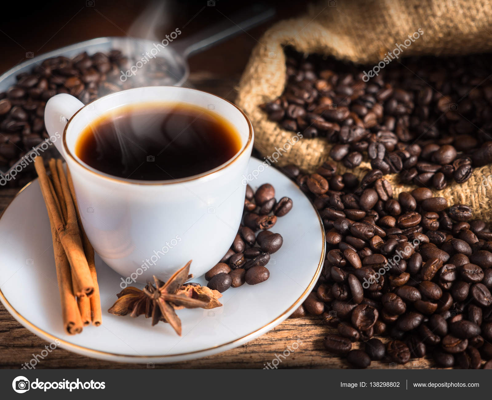 Hot coffee mug with cup and coffee bean bag Stock Photo by ©singkham  138298802