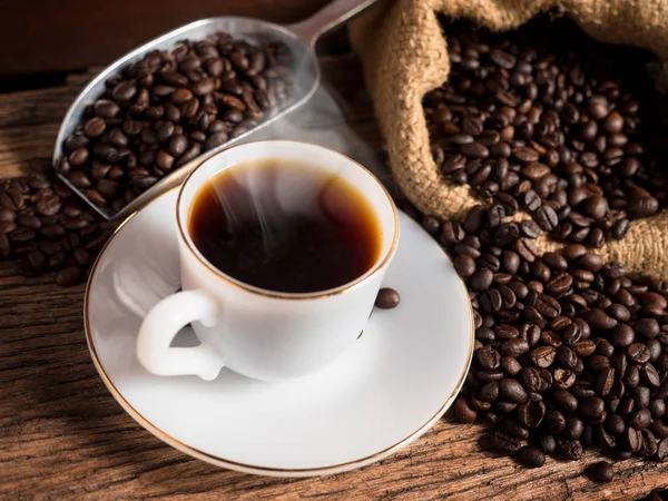 Hot coffee mug with cup and coffee bean bag Stock Picture