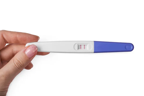 妇女手中的妊娠期测试棒阳性的分离 令人惊讶 — 图库照片