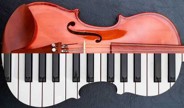 Piano keys in to the violin on the black leather table, half keyboard like violin shape Royalty Free Stock Images