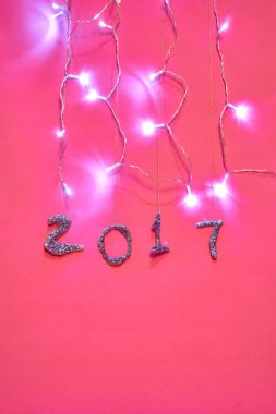 2017 parıltı ve Noel ışıklar açık pembe bir arka plan ile yapılan