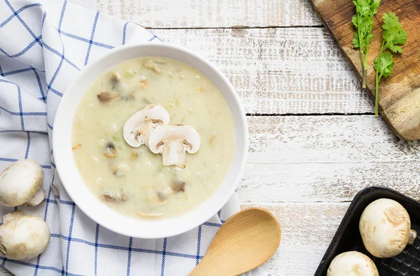 Mushroom cream soup on white wooden board. top view — Stock Image Mushroom Cream Soup White Wooden Board Top View Royalty Free Stock Images