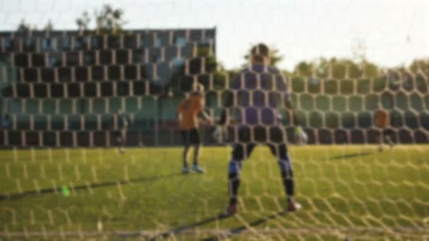 Goalkeeper jumps near the gate in slow motion, team playing match, amateur championship — Stock Video