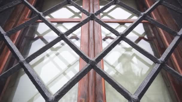 Old architectural window with a metal beautiful lattice, background, copy space — Stock Video