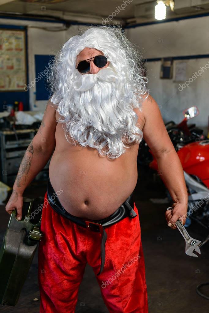 Santa on a motorcycle — Stock Photo © Rafinade #130422324