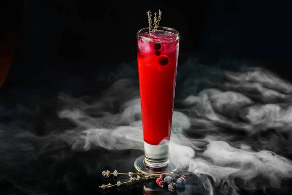 Black currant cocktail on black background — Stock Photo, Image