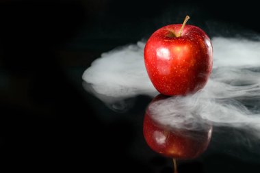 Apple in fragrant smoke