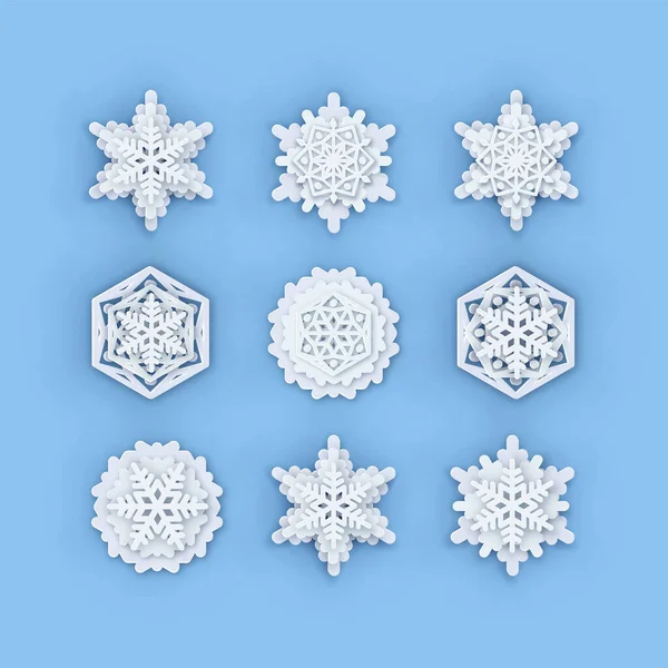 Coleção de flocos de neve vetorial. Formas de floco de neve de papel. Sílhueta simétrica de flocos de neve cortada em papel isolada em azul. Ícones de decoração tema clima de inverno. Natal gerado digitalmente, impressão Noel Vetores De Bancos De Imagens Sem Royalties