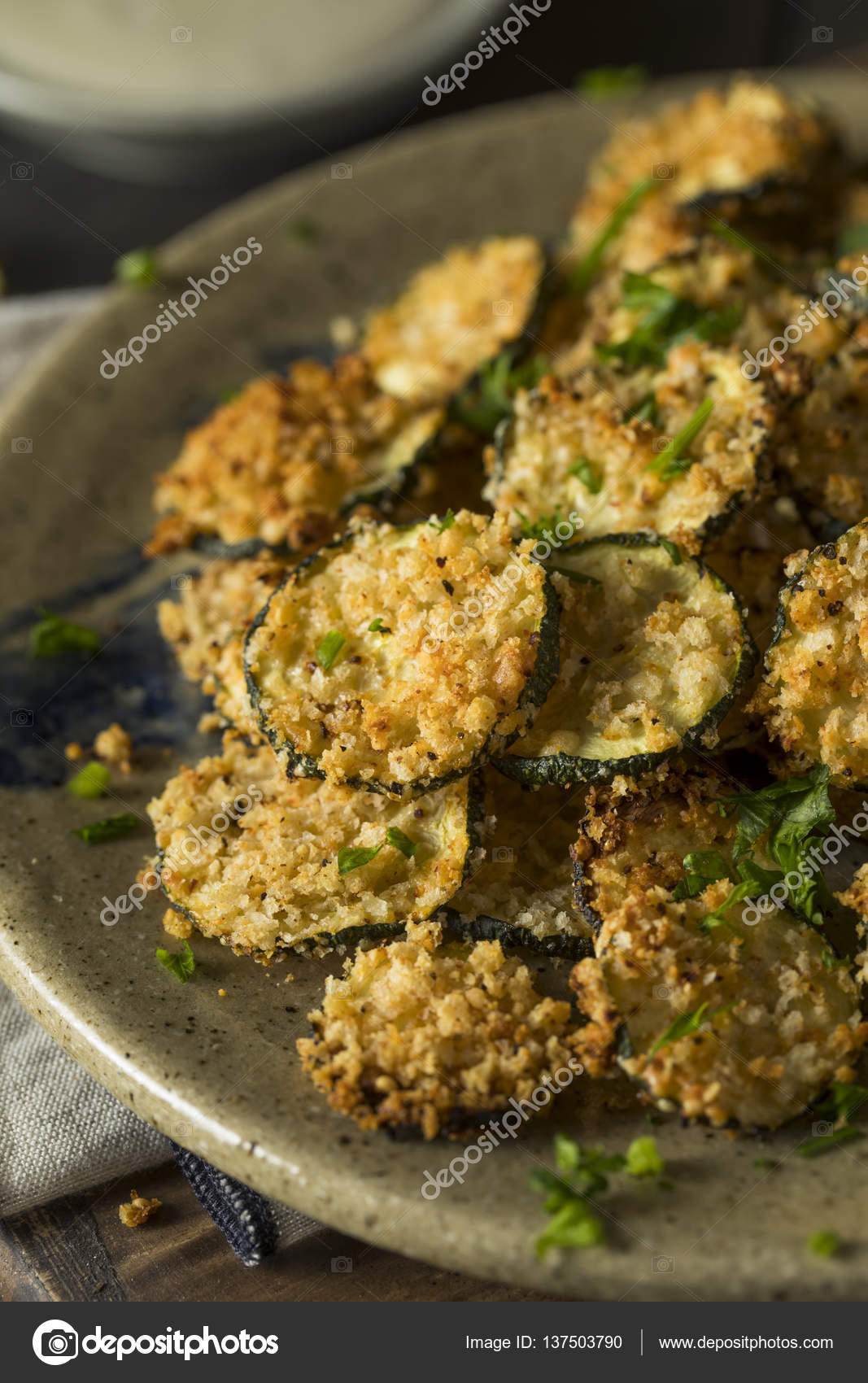 Homemade Breaded Baked Zucchini Chips Stock Photo by ©bhofack2 137503790