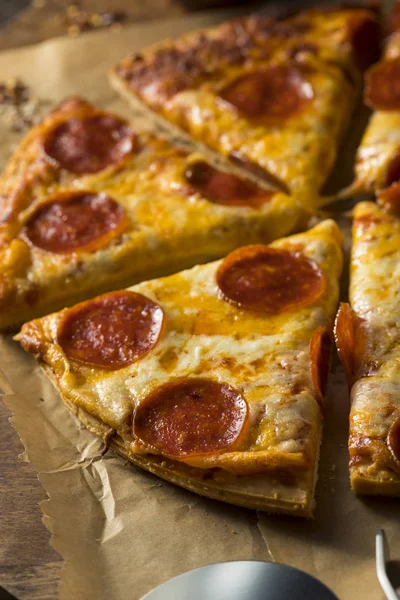 Cheap Greasy Frozen Pepperoni Pizza — Stock Photo, Image