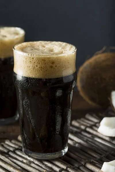 Refreshing Cold Dark Coconut Beer — Stock Photo, Image