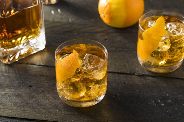 Boozy Homemade Old Fashioned Bourbon on the Rocks — Stock Photo, Image