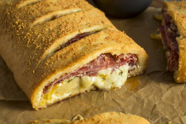 Homemade Cheesy and Meaty Italian Stromboli — Stock Photo, Image